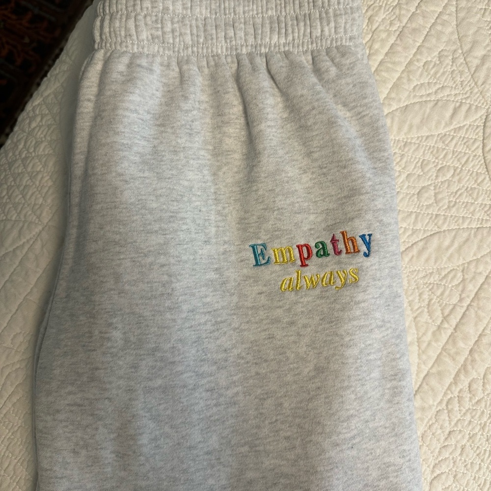 The Mayfair Group — “Empathy Always” grey sweatpants